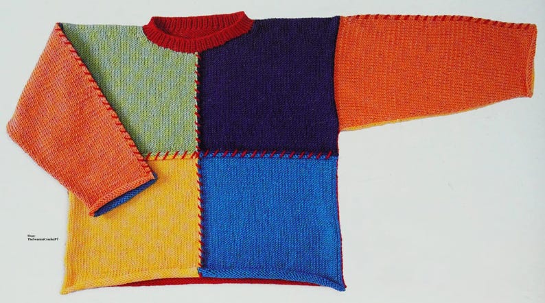 May include: A colourful knitted jumper with a patchwork design. The jumper is made of different coloured squares of yarn, including orange, yellow, green, blue, and purple. The seams are visible and are a contrasting red colour.