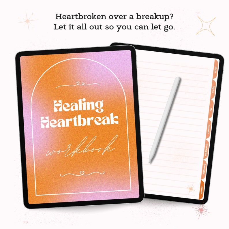 May include: A digital tablet with a pink and orange gradient background. The text "Healing Heartbreak workbook" is written in white on the screen. The tablet is open to a blank page with lined paper and a white stylus.