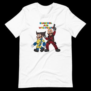 May include: White t-shirt with a colorful graphic of Deadpool and Wolverine, with the text "DEADPOOL AND WOLVERINE" above them.