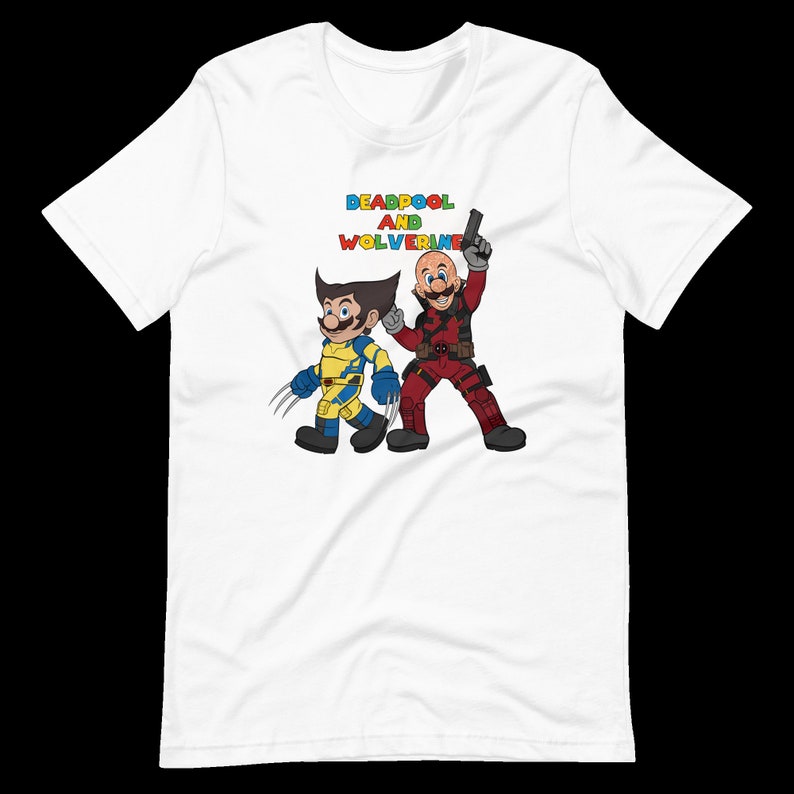 May include: White t-shirt with a colorful graphic of Deadpool and Wolverine, with the text "DEADPOOL AND WOLVERINE" above them.