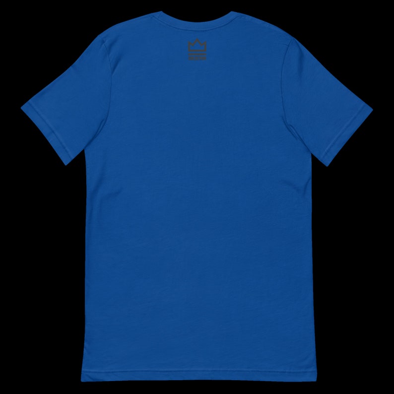 May include: A royal blue t-shirt with a small black crown logo on the back.