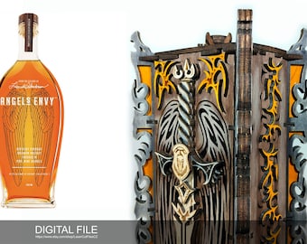 May include: A wooden box with a laser cut design of a sword with wings. The box is painted in shades of brown, black, and yellow. The box is designed to hold a bottle of Angels Envy whiskey.