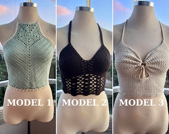 May include: Three crochet halter tops in different colors and styles. Model 1 is a light green halter top with a geometric pattern. Model 2 is a brown halter top with a lacy pattern. Model 3 is a beige halter top with a bow detail.