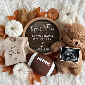 May include: A fall-themed pregnancy announcement with a teddy bear, football, and pumpkins. The announcement includes a baby sweater with the name "Smith", a sonogram, and the text "Half Time" with the due date "MARCH 2026".