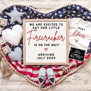 May include: A pregnancy announcement with a red, white, and blue theme. A letter board says "We are excited to say our little Firecracker is on the way! Arriving July 2025". A white onesie says "Baby Oliver" with a small heart. A sonogram image is in the corner.
