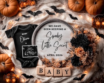 May include: A Halloween-themed baby announcement. A black babygrow with "Baby Oliver" printed on it, an ultrasound image, and a wooden sign that reads "We have been keeping a Spooky Little Secret, April 2026". Pumpkins and bats are also present.