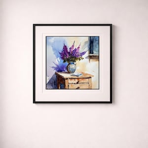 May include: Watercolor painting of a vase filled with purple flowers on a wooden table. The vase is blue and the table has two drawers. A window is visible in the background, and the painting is framed in black.