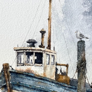 May include: A watercolor painting of a weathered boat with a white cabin and blue hull, featuring a tall mast and rigging. A white and gray seagull is perched on a dark wooden piling in the foreground against a soft, muted gray sky background.