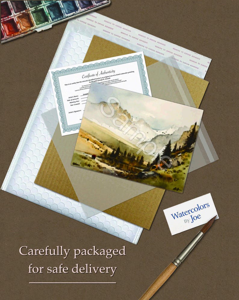 May include: A watercolour landscape painting featuring mountains and pine trees, accompanied by a Certificate of Authenticity, a business card reading Watercolors By Joe, a paintbrush, and protective packaging materials for safe delivery.