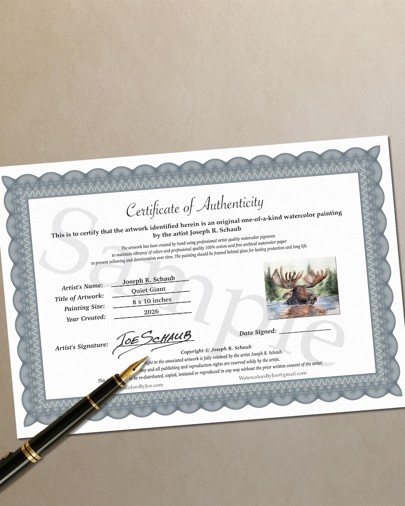 May include: A white Certificate of Authenticity document with a gray decorative border, featuring the text Certificate of Authenticity, artist Joseph R. Schaub, title Quiet Giant, 8 x 10 inches, and a small watercolor image of a moose in water.
