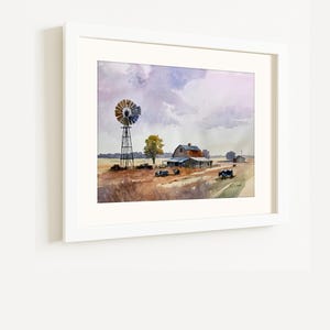 May include: Watercolor painting of a rural landscape featuring a windmill, barn, and fields under a cloudy sky. The artwork is framed in a white border, showcasing a serene countryside scene with muted colors and a vintage aesthetic.