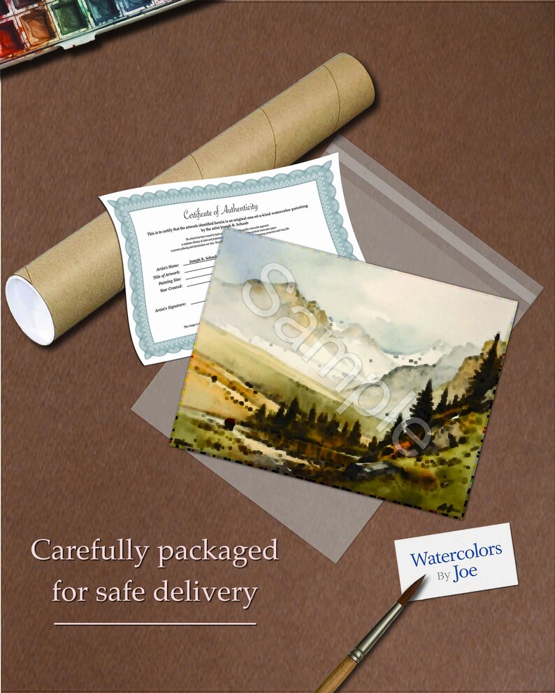 May include: A watercolor painting of a mountain landscape with a certificate of authenticity, a rolled-up tube, and a paintbrush. The painting is in a clear plastic sleeve. The text "Sample" is visible on the painting. The painting is labeled "Watercolors By Joe".