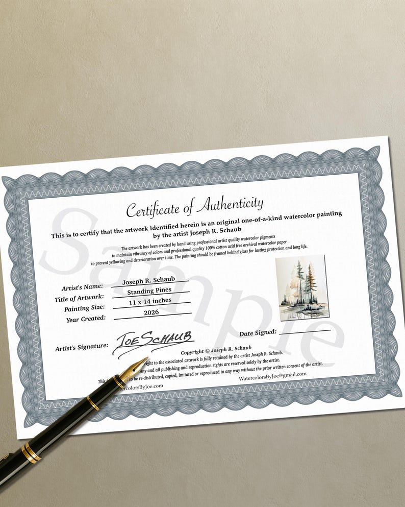 May include: A Certificate of Authenticity document with a gray decorative border, featuring the text Standing Pines, artist Joseph R. Schaub, and the year 2026. A small image of a pine tree watercolor painting is included, alongside a black fountain pen.