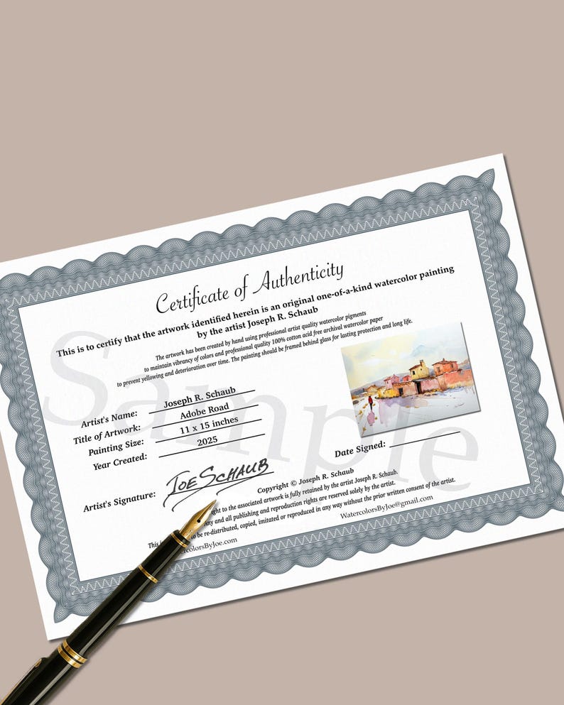 May include: A certificate of authenticity for a watercolour painting by Joseph R. Schaub. The certificate states the painting's title, "Adobe Road," and dimensions of 28 x 38 cm. The artist's signature and copyright details are included, along with material information.