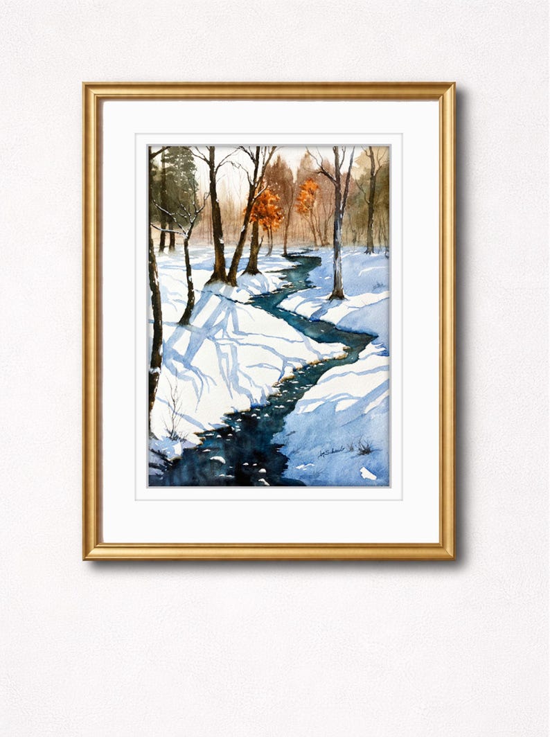 May include: Watercolor painting of a winter landscape with a winding stream. The artwork features a snow-covered scene with bare trees and a golden frame. The stream's water is a deep blue, contrasting with the white snow.
