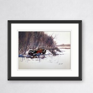 May include: Watercolour painting of a vintage red and black car in a snowy landscape. The car is partially covered in snow, with bare trees in the background. The artwork is framed in a black frame with a white mount.
