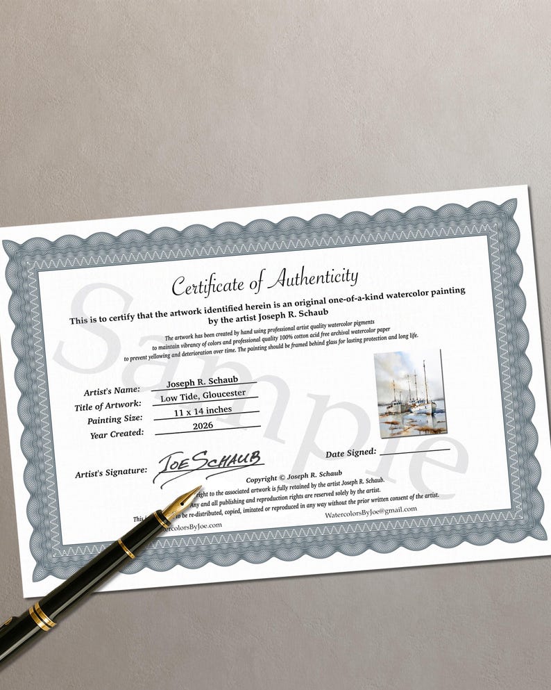 May include: A Certificate of Authenticity for an original watercolor painting by Joseph R. Schaub titled Low Tide, Gloucester. The document features a gray decorative border, a small image of the painting, and a black fountain pen resting nearby.