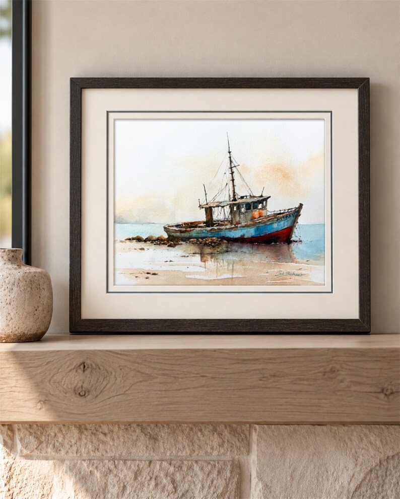 May include: A framed watercolor painting depicting a weathered fishing boat resting on a sandy shore. The vessel features a blue hull with a red bottom, a cabin, and a mast. The background shows a soft, hazy sky and calm water in muted tones.