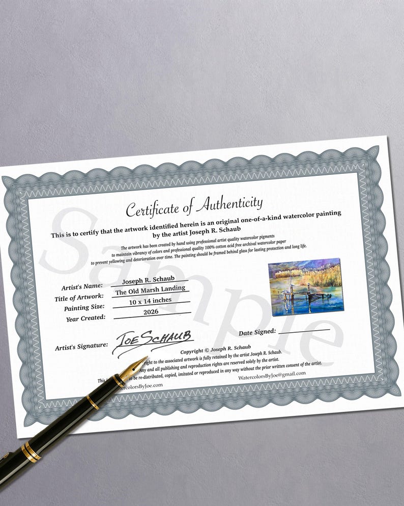 Puede incluir: Un certificado de autenticidad para una pintura de acuarela titulada The Old Marsh Landing del artista Joseph R. Schaub. El documento presenta un borde decorativo gris, una peque&ntilde;a imagen de la pintura y el texto 10 x 14 inches. Una pluma estilogr&aacute;fica negra descansa sobre el documento.