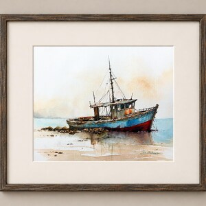 May include: A framed watercolor painting depicting a weathered blue and red fishing boat resting on a sandy shore. The vessel features a mast, cabin, and orange buoys, with soft, muted tones of beige and light blue in the background sky and water.