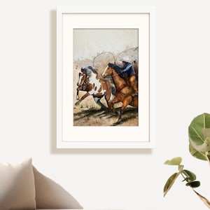 May include: Watercolor painting of two horses with riders in a white frame. One horse is brown and white, the other is brown. The riders are wearing cowboy hats and blue shirts. The artwork is displayed on a white wall.