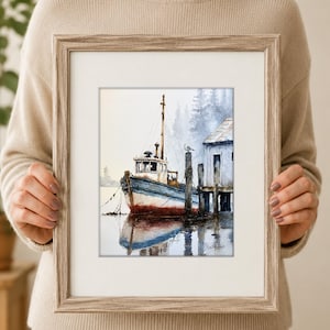 May include: A framed watercolor painting depicting a blue and white fishing boat moored at a wooden dock. The scene features a small structure on the pier, a seagull perched on a post, and a misty forest background with a reflection in the water.