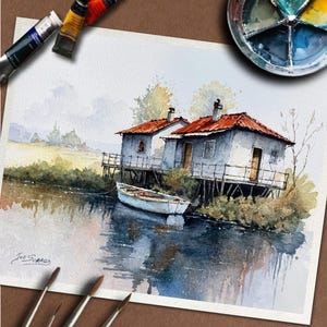May include: Watercolor painting of two small, light blue houses with red roofs on stilts over water. A white boat floats nearby. The painting includes reflections in the water and is signed "Joe Scralla". Paint tubes and a palette are in the image.