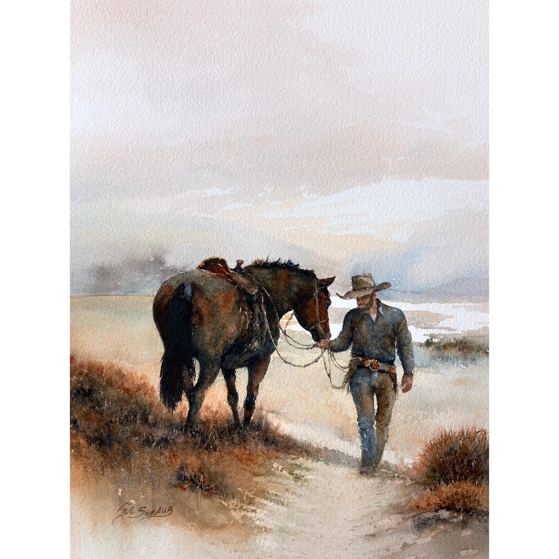 May include: Watercolor painting of a cowboy leading a saddled horse along a dirt path. The cowboy wears a hat, blue shirt, and jeans. The horse is brown with a dark mane and tail. The background features a muted landscape.