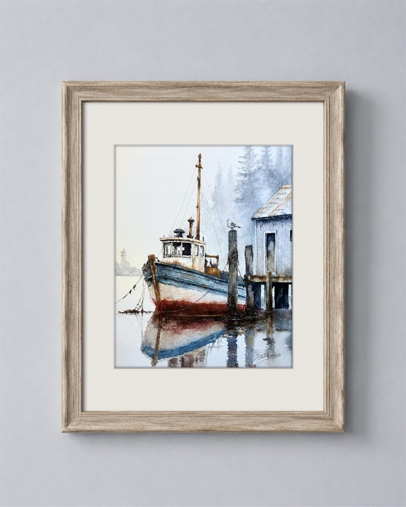 May include: A framed watercolor painting depicting a blue and white fishing boat moored at a wooden dock next to a small shed. The scene features a misty background with evergreen trees, a seagull on a post, and a reflection in the water.