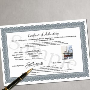 May include: A white Certificate of Authenticity with a blue decorative border, featuring the text Morning Watch, artist Joseph R. Schaub, and a small watercolor image of a boat. A black fountain pen rests on the document, which lists 8 x 10 inches.