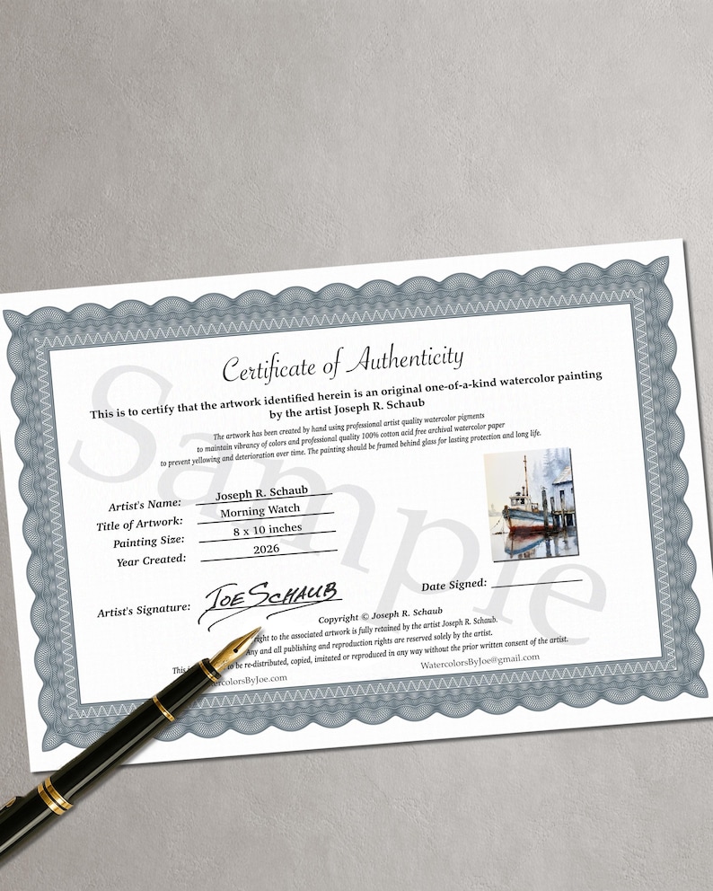 May include: A white Certificate of Authenticity with a blue decorative border, featuring the text Morning Watch, artist Joseph R. Schaub, and a small watercolor image of a boat. A black fountain pen rests on the document, which lists 8 x 10 inches.