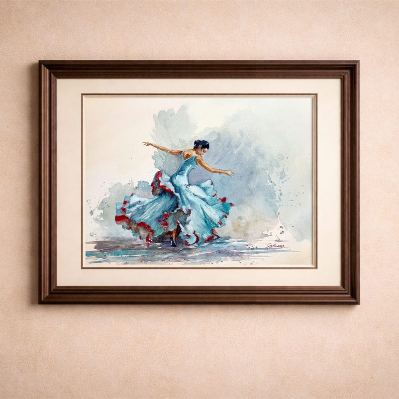 May include: Watercolor painting of a dancer in a flowing blue dress with red accents, framed in a dark wood frame. The dancer is in motion, arms outstretched, set against a soft, watercolor background. The artwork is a framed print.