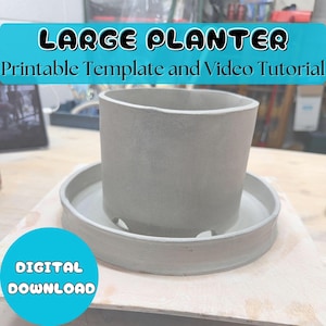 May include: A grey ceramic planter with a matching saucer. The planter is cylindrical with a slightly irregular top edge. The saucer has drainage holes. Text on the image reads "LARGE PLANTER Printable Template and Video Tutorial" and "DIGITAL DOWNLOAD".