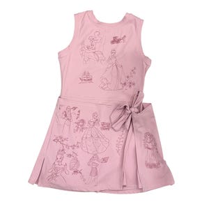 May include: Pink sleeveless dress with a wrap skirt and bow. The dress features line drawings of various princesses and related imagery. The illustrations are in a darker shade of pink. The dress is made of a soft, lightweight fabric.