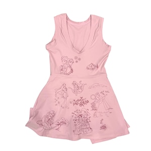 May include: A light pink sleeveless dress featuring a V-neckline and a flared skirt. The dress is adorned with various cartoon illustrations of princesses. The illustrations are in a darker shade of pink, creating a subtle contrast.