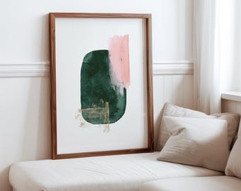 May include: Abstract art print with a green and pink watercolor design in a wooden frame. The print features a large green shape with a pink shape overlapping it.