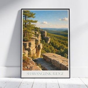 May include: Framed print of Shawangunk Ridge, featuring a scenic landscape with a rocky cliffside, lush green trees, and a blue sky with clouds. The print has a vintage aesthetic.