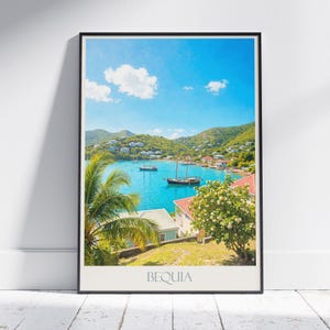 May include: A framed print featuring a vibrant coastal scene. The image showcases a turquoise bay with sailboats, lush green hills dotted with buildings, and a bright blue sky with fluffy white clouds. The word "BEQUIA" is printed at the bottom.