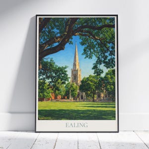 May include: Framed art print featuring a detailed painting of a tall church with a steeple, surrounded by lush green trees and a grassy lawn. The sky is a clear blue. The word "EALING" is printed at the bottom.