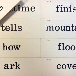 May include: Black and white text on white cards. The text reads "time tells how ark" and "finish mountain flood cove".