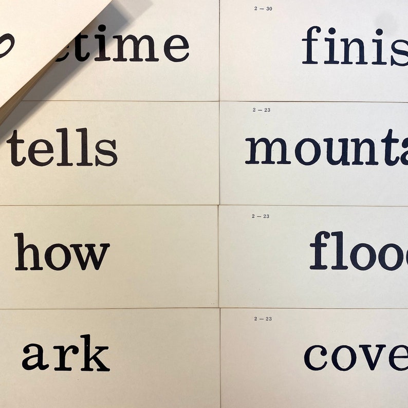 May include: Black and white text on white cards. The text reads "time tells how ark" and "finish mountain flood cove".
