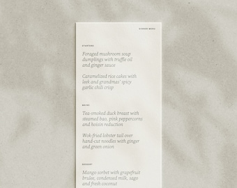 May include: A white menu with black text listing the dinner menu. The menu includes starters, mains, and dessert. The starters include foraged mushroom soup dumplings with truffle oil and ginger sauce, caramelized rice cakes with leek and grandmas' spicy garlic chilli crisp. The mains include tea-smoked duck breast with steamed bao, pink peppercorns and hoisin reduction, wok-fried lobster tail over hand-cut noodles with ginger and green onion. The dessert includes mango sorbet with grapefruit brulee, condensed milk, sago and fresh coconut.