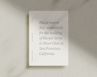 May include: A white card with black text announcing a wedding. The text reads: "Please reserve July seventeenth for the wedding of Harper Stone & Oliver Chen in San Francisco, California."