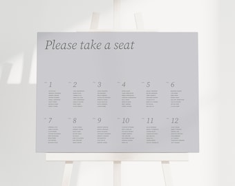 May include: A grey seating chart with the text "Please take a seat" at the top. The chart is divided into 12 sections, each with a number from 1 to 12. Each section lists names of guests.