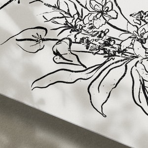 May include: Black and white line art print of a floral bouquet with leaves and flowers.