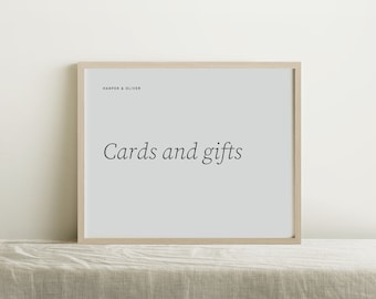 May include: A light wood frame with a white background and the text "Cards and gifts" in black font. The text "Harper & Oliver" is in smaller font at the top of the frame.