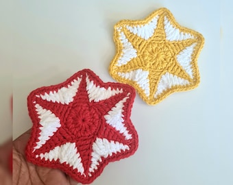 May include: Two crocheted star-shaped coasters, one red and white, and one yellow and white.