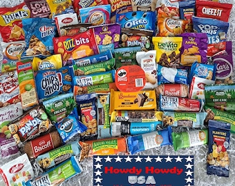 May include: A variety of snack foods in colorful packaging, including crackers, chips, cookies, granola bars, and cereal. The snacks are arranged in a random pattern on a white surface. The text "Howdy Howdy USA All American. All for YOU!" is printed on a red, white, and blue star-shaped banner.