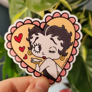 B boop vinyl sticker, laced heart, vintage cartoons, retro, kawaii, blowing kiss, rubberhose, aesthetic, pink, animation