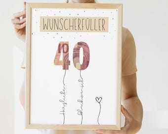 May include: A white framed poster with the text "Wunscherschüller" at the top. The number 40 is made of ten euro bills and is surrounded by small white dots. The text "Herzlichen Glückwunsch" is written below the number 40.